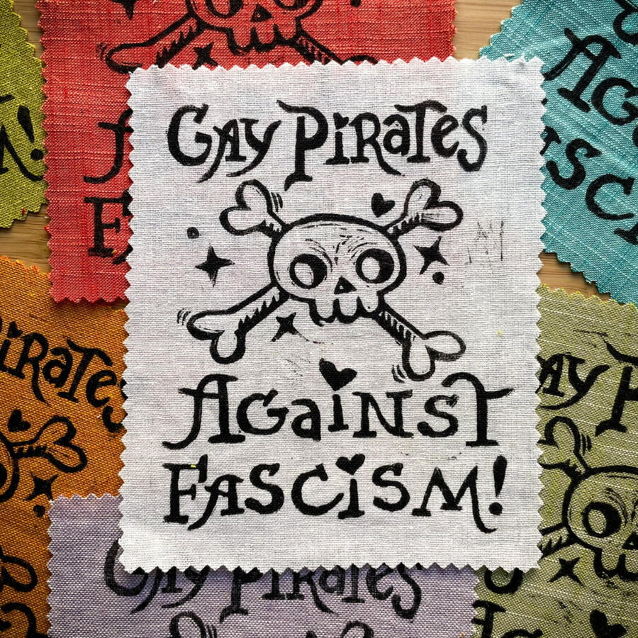 Gay Pirates Against Fascism | shop Block printed patches that read "Gay Pirates Against Fascism" with a skull and crossbones and hearts